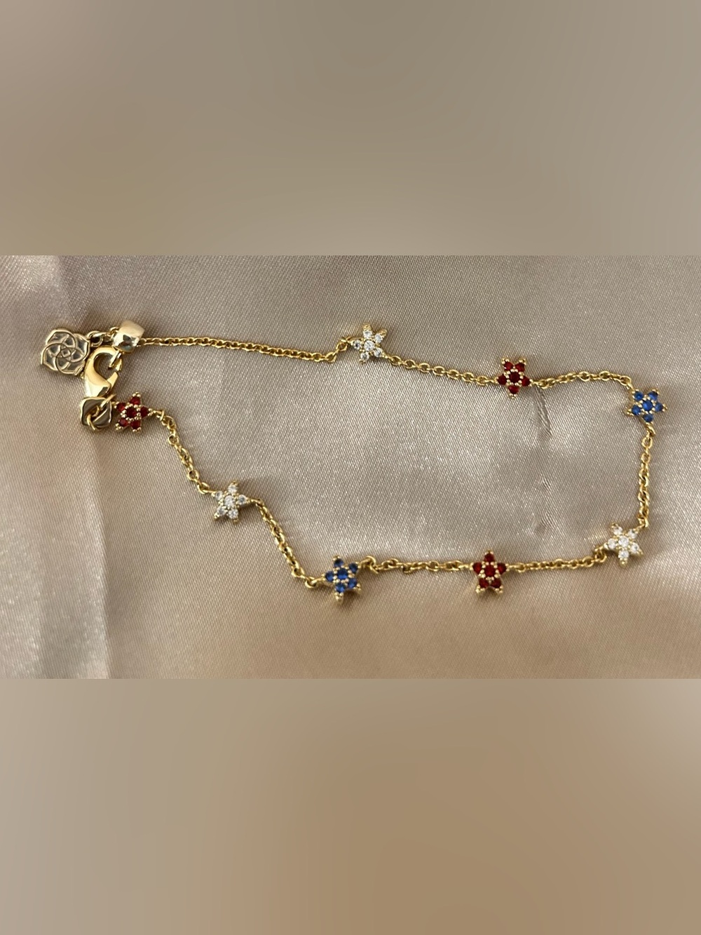 Kendra Scott Gold tone Star Bracelet with Red, Blue and White Accent Stones
